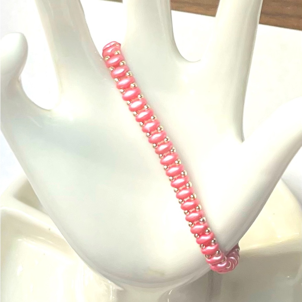 Pink and gold bracelet.